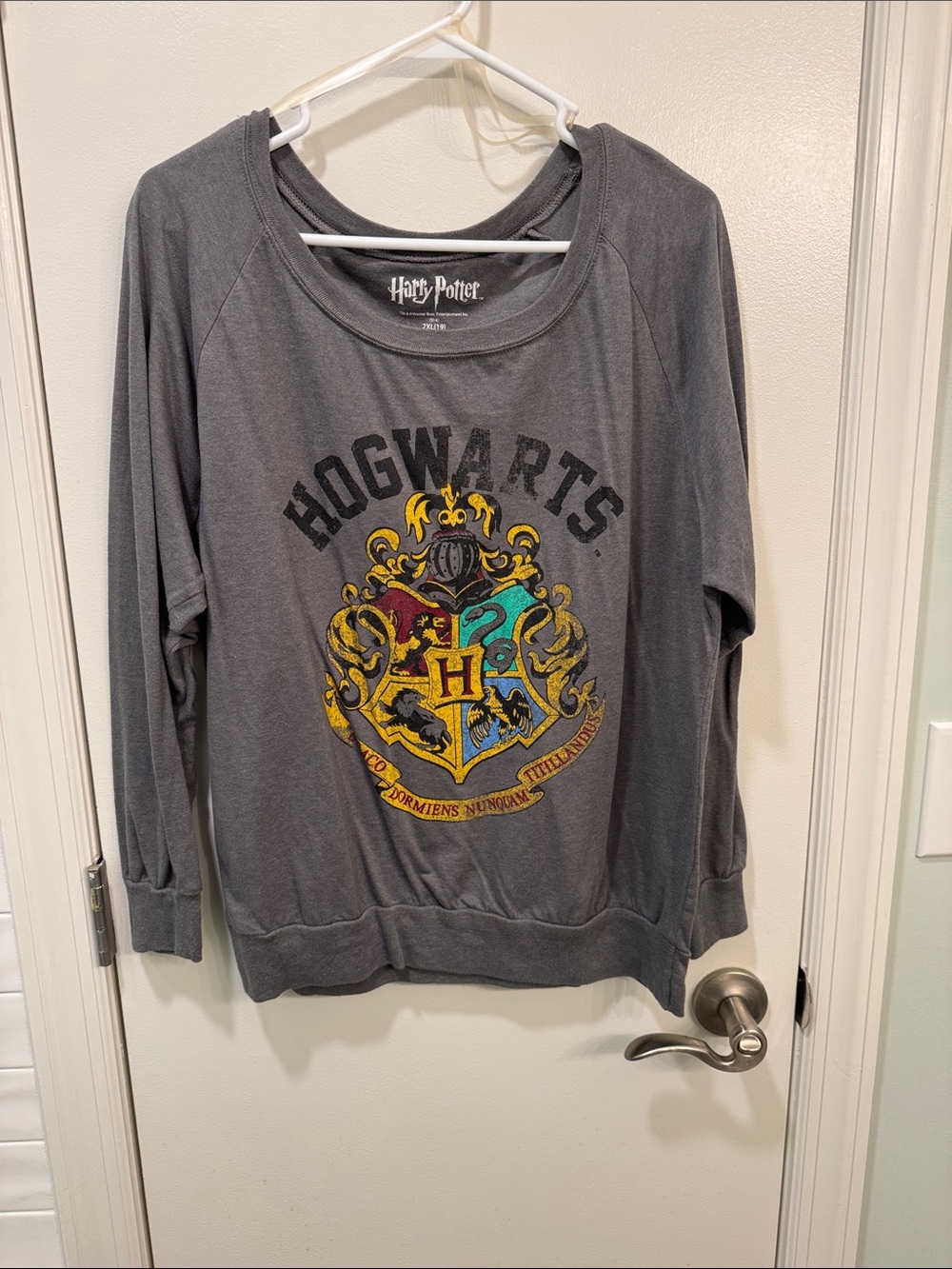 Warner Bros. Hogwarts Crewneck Sweater in Gray with Multicolor Crest